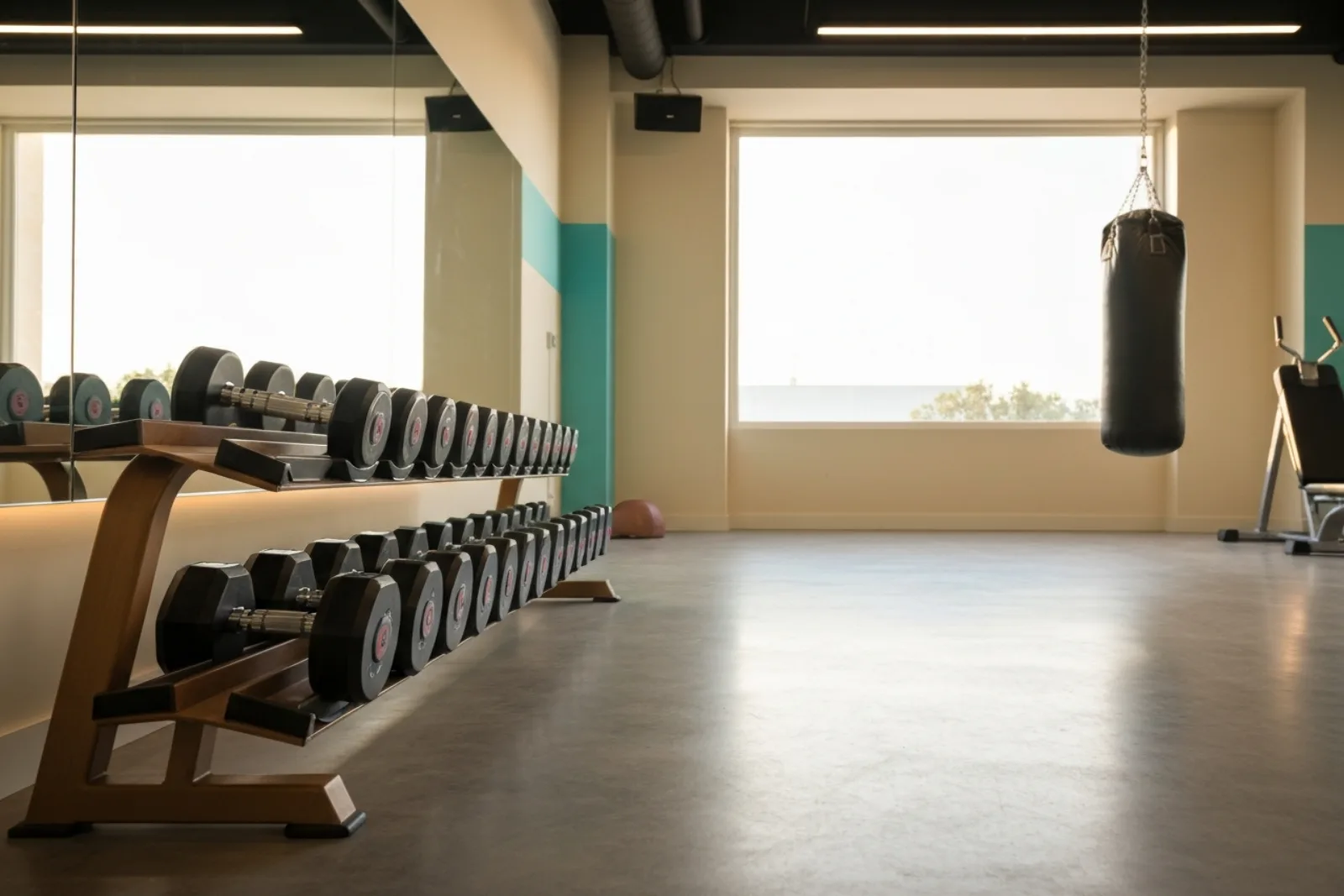 Dumbbell weight rack and punching bag in a bright Sliema fitness gym, representative of the best gyms in Malta.