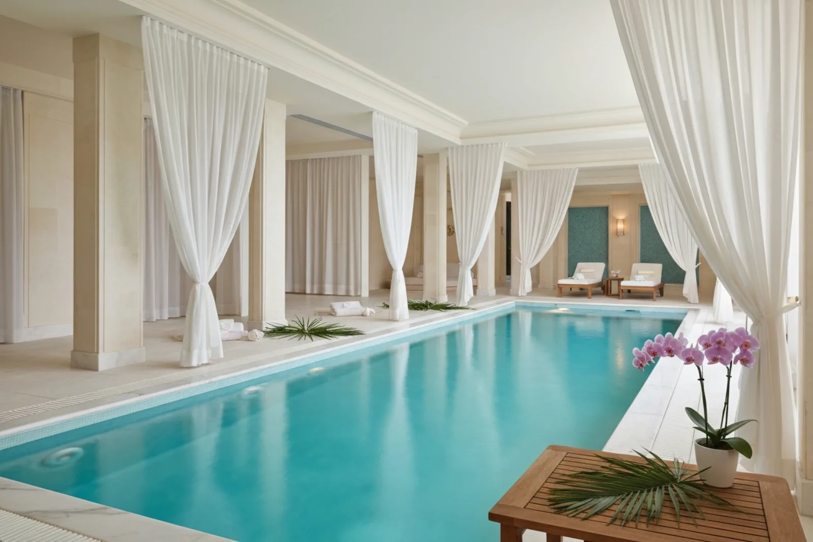 Indoor pool with white drapes at Myoka Lotus Spa, among the luxury spas and wellness centres in St Julian's, Malta.