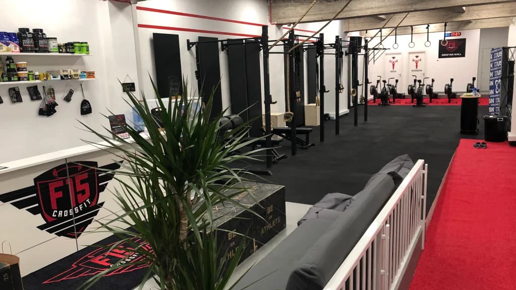 Kettlebell rack and gymnastic rings inside CrossFit F15, one of the top fitness gyms in Msida, Malta.