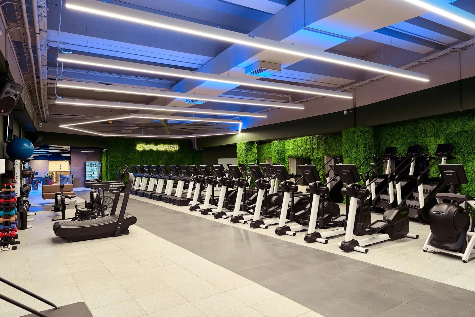 Spacious fitness gym in St Julian's, Malta, featuring kettlebells, gymnastics rings, and an open layout for diverse workouts.