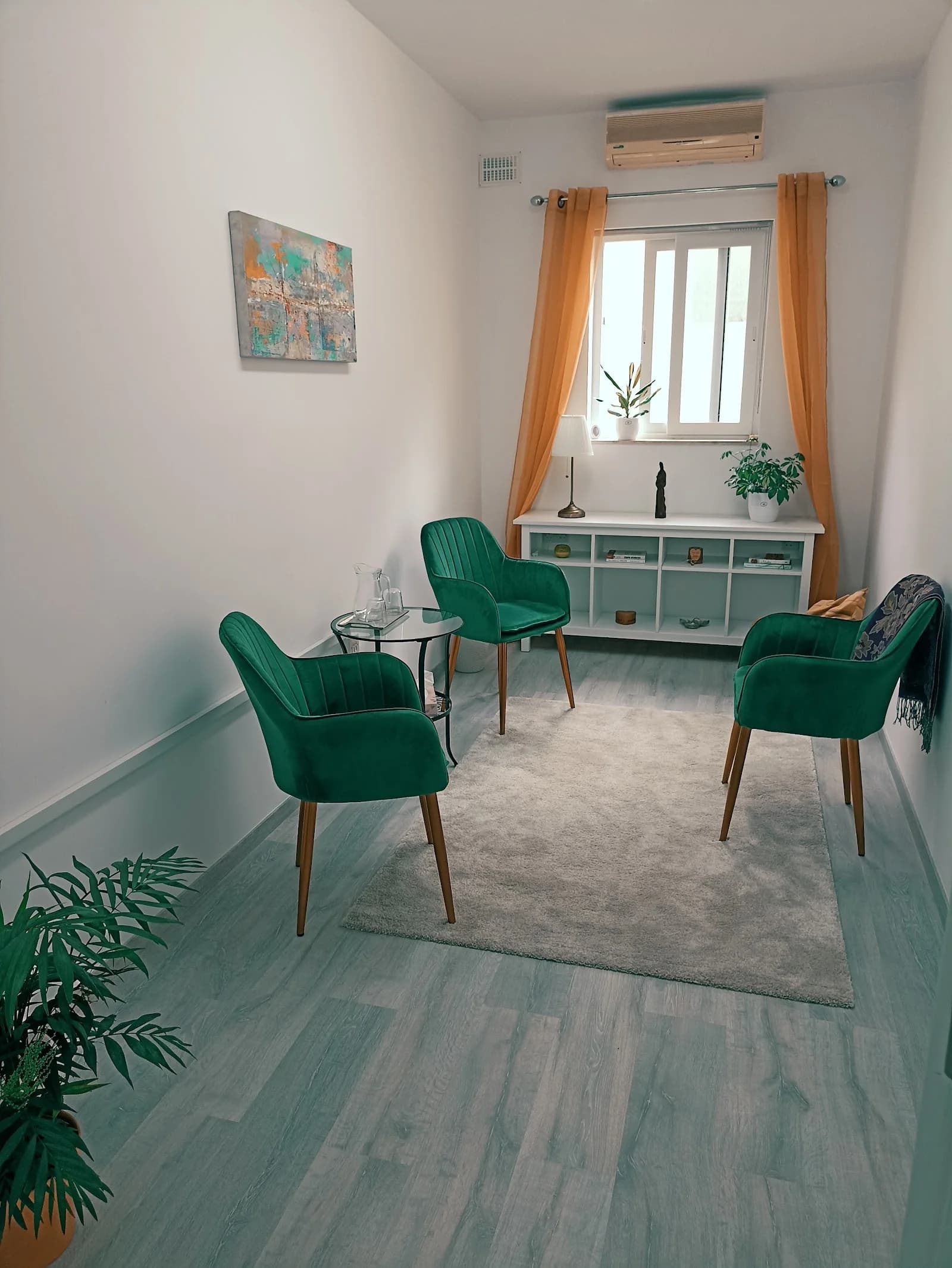 Wooden bench and lavender by a turquoise door in a sunlit Ta'Xbiex courtyard for mental health therapy in Malta.