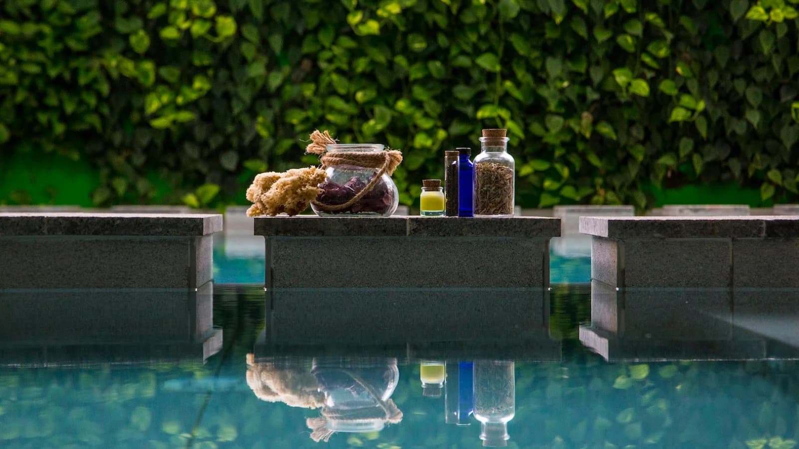Minimalist indoor float therapy pool with glowing turquoise water at Sanya Eco Spa in Naxxar, Malta.