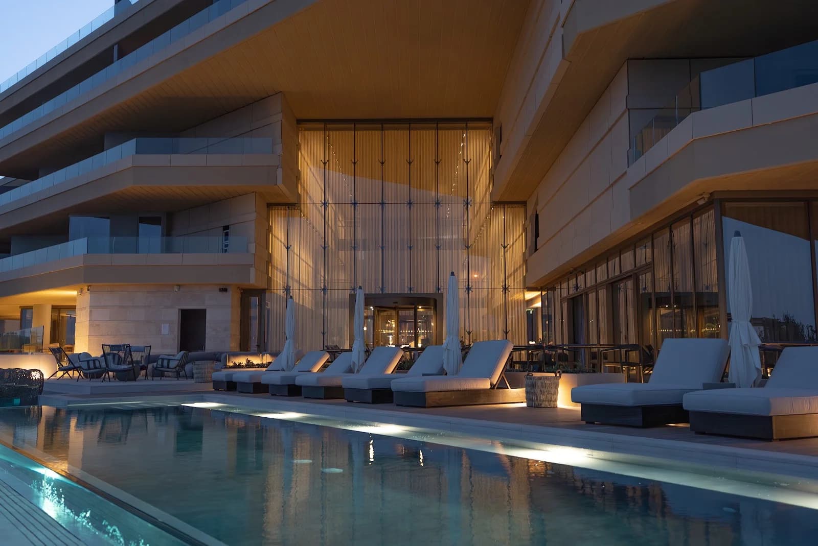 A tranquil stone courtyard with a fountain and citrus trees at Verdala Wellness Hotel for retreats in Rabat, Malta.